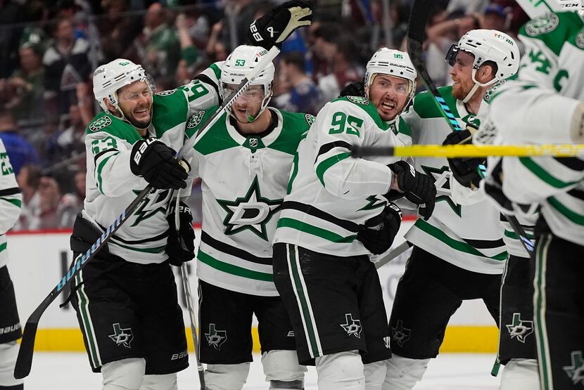 Dallas Stars center Matt Duchene, third from left, is congratulated after scoring the...