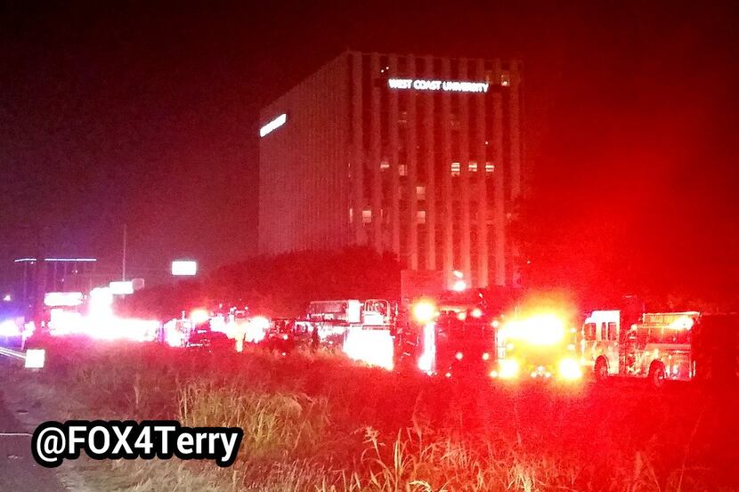 Fire crews put out a possible electrical fire at a high-rise Friday night in Stemmons Corridor.