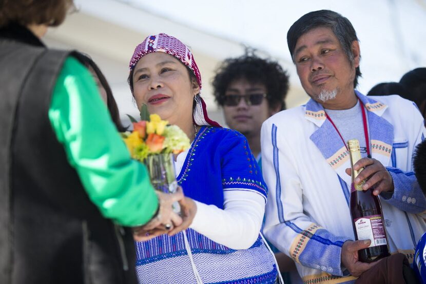  Hsar Lay and her husband, Maung, accepted housewarming gifts at the dedication of their new...