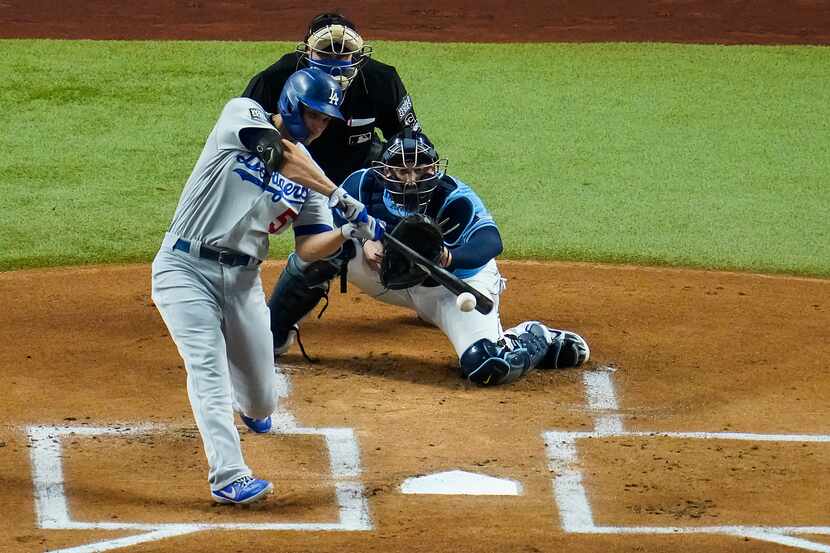 Los Angeles Dodgers shortstop Corey Seager drives in a run with a single as Tampa Bay Rays...