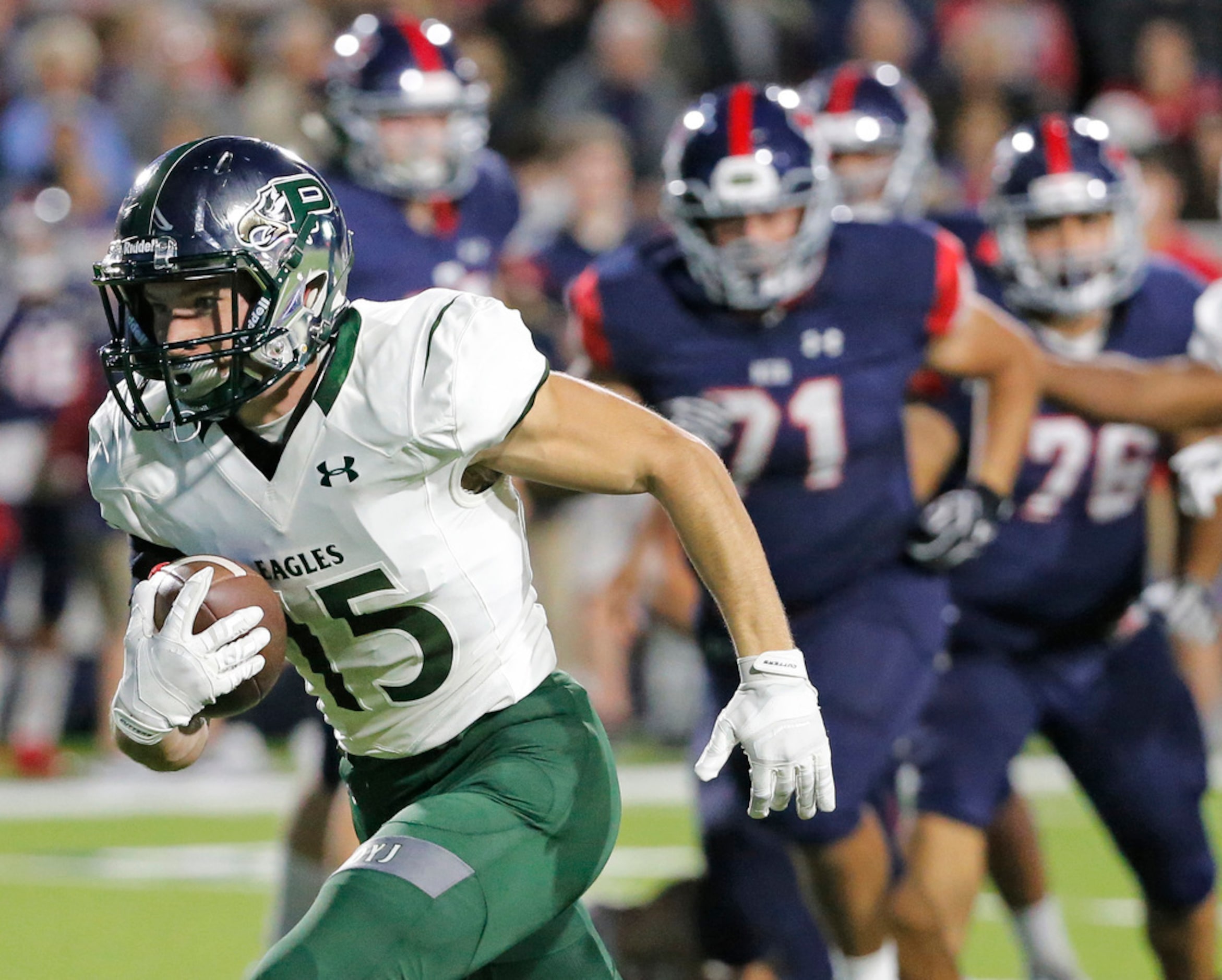 Prosperdefensive back Logan Nelson (15) picks up a fumble and runs for a touchdown in the...