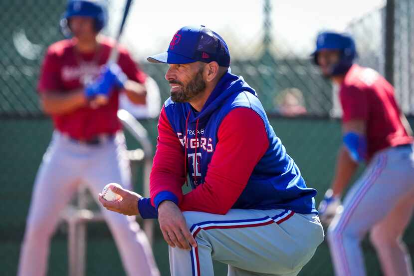 Texas Rangers manager Chris Woodward watches during a Rangers minor league spring camp...