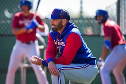 Texas Rangers manager Chris Woodward watches during a Rangers minor league spring camp...
