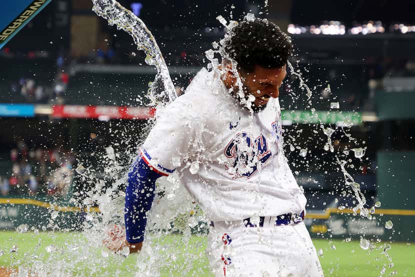 Texas Rangers' Marcus Semien is doused after the team's win over the Los Angeles Angels in a...