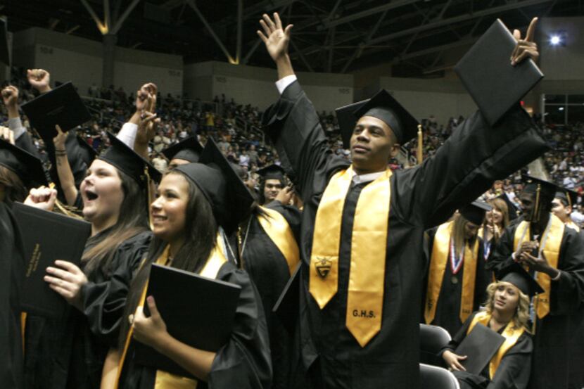 Garland High School graduates celebrate at the end of commencement ceremonies on May 31 at...
