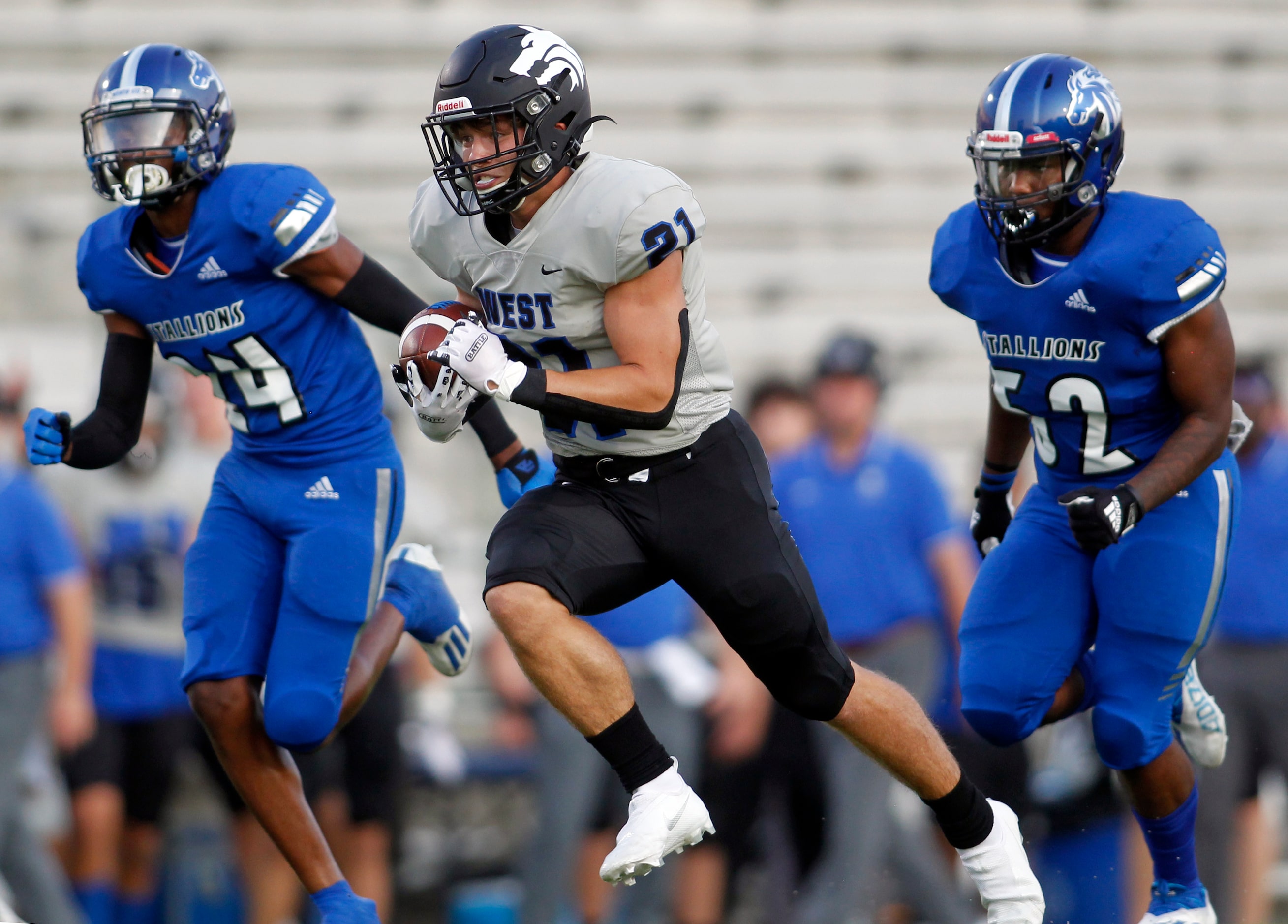 Plano West running back Dermot White (21) sprints to the end zone for a first quarter...