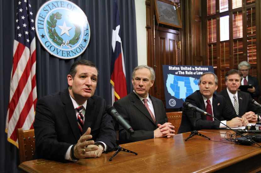 AUSTIN, TX -  FEBRUARY 18:  (L -R) U.S. Sen. Ted Cruz (R-TX), Governor Greg Abbott, Attorney...