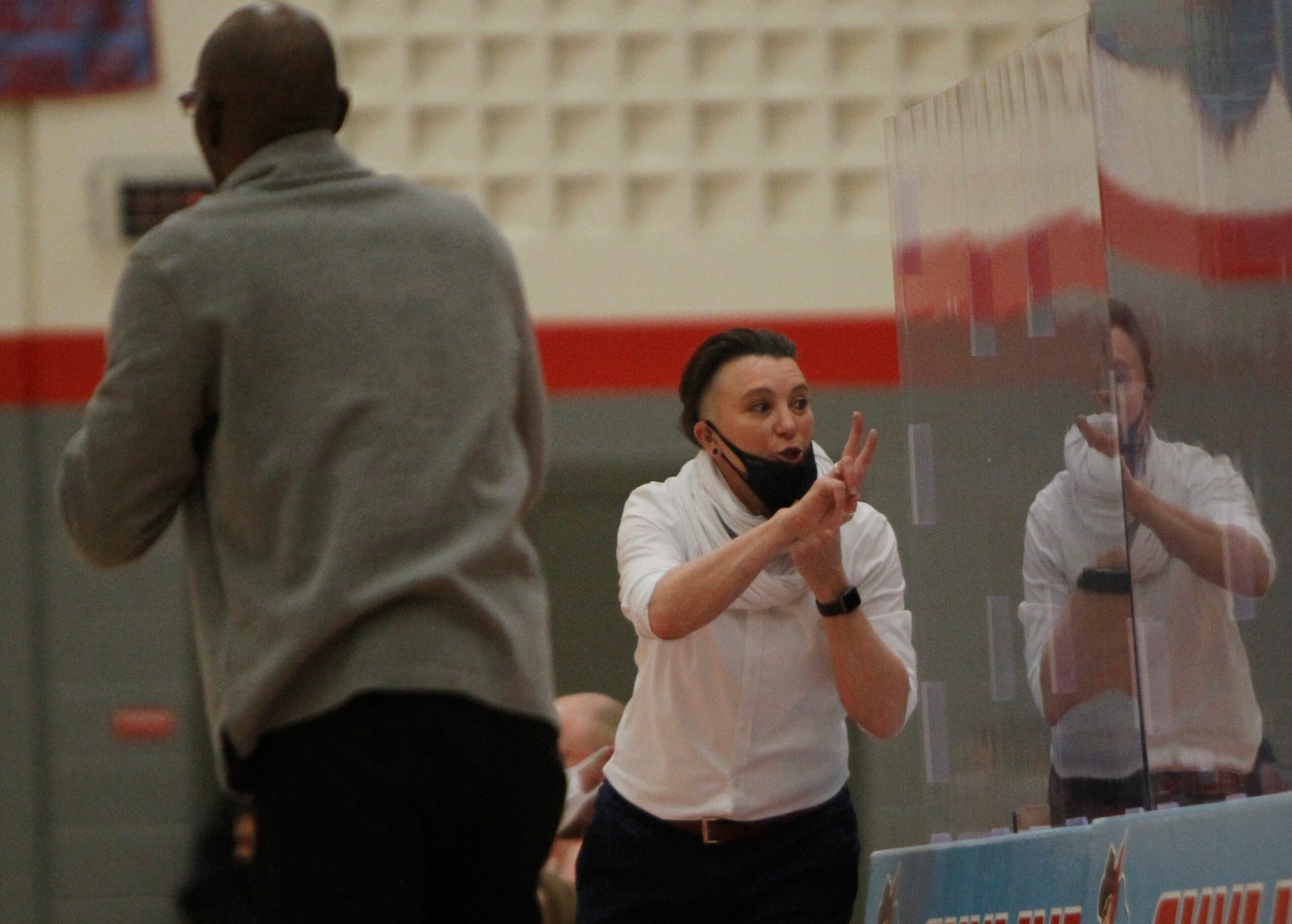 Dallas Woodrow Wilson head coach Liz Schubert consults with a scoring official during first...