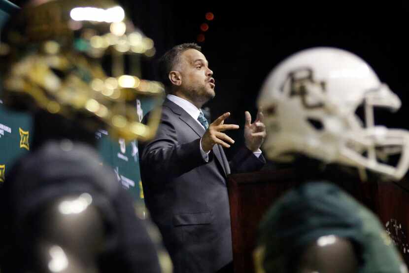 After being introduced, Baylor University's new head football coach Matt Rhule speaks to the...