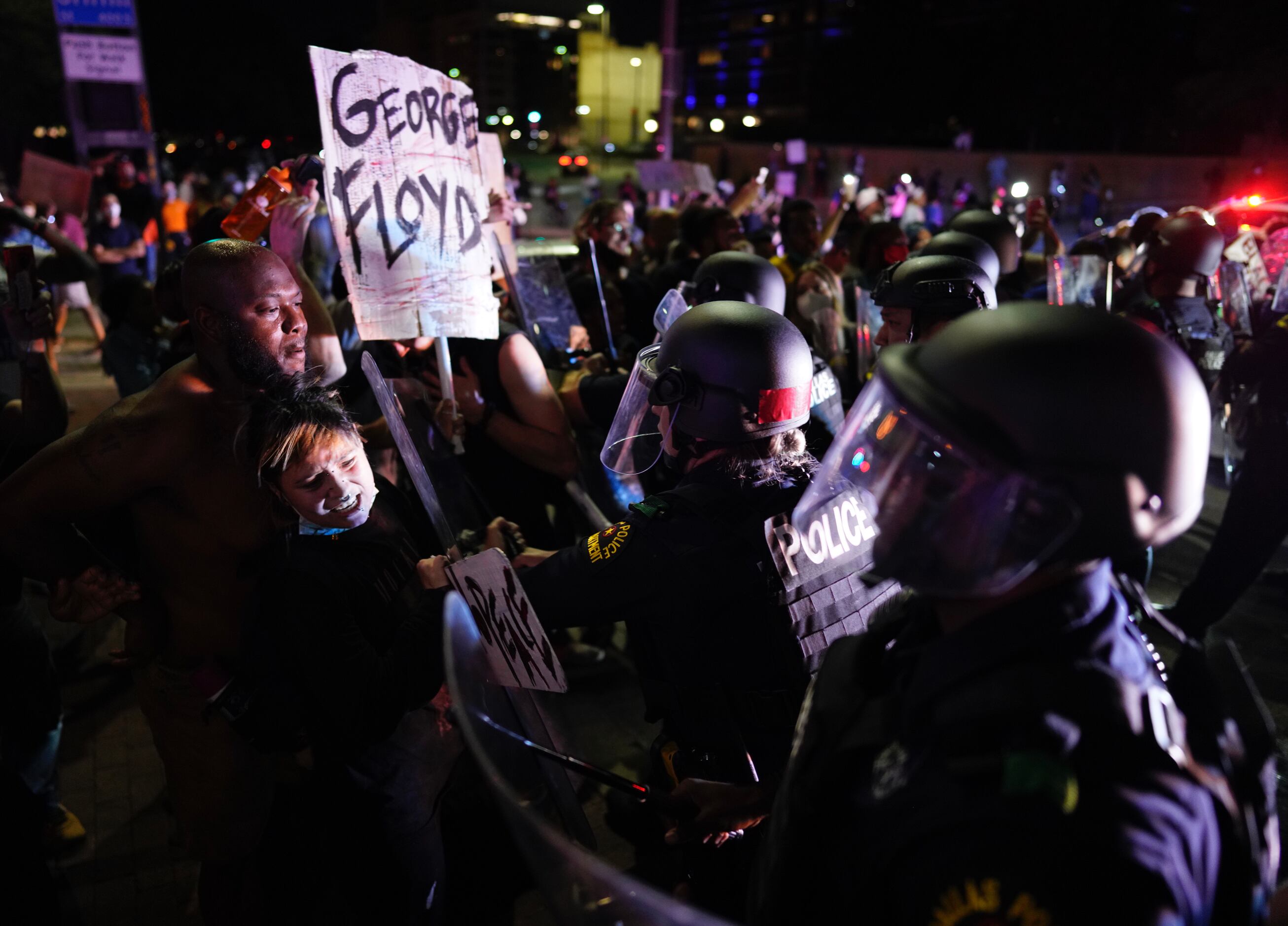 Protesters clash with Dallas police at Griffin and Young on Friday, May 29, 2020, in Dallas....