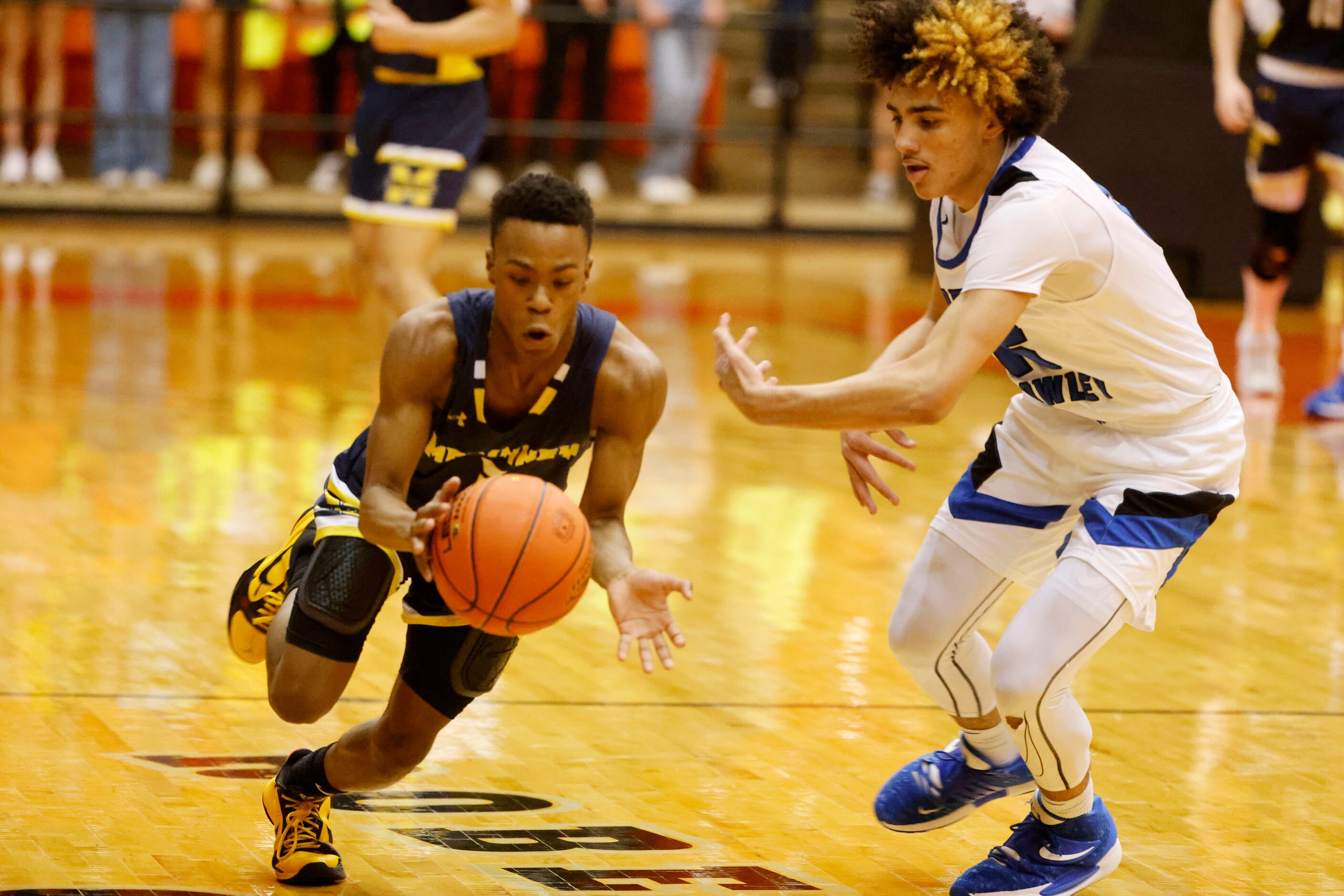 Mckinney’s Jacovey Campbell (3) steals the ball from North Crowley’s Kamoni Sieber, right,...