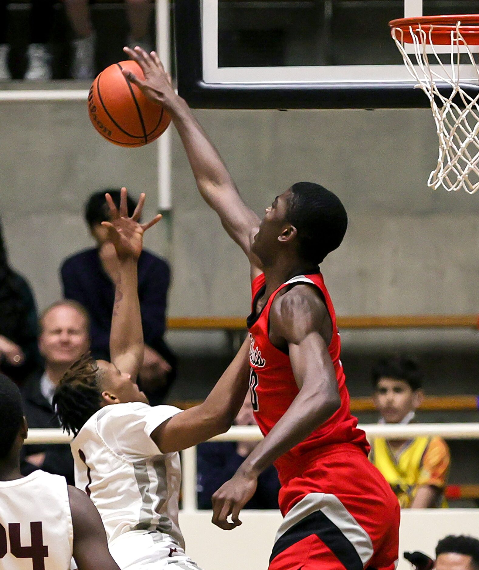 Lake Highland center Samson Aletan (10) blocks a shot from Plano guard Makhi Dorsey (1)...