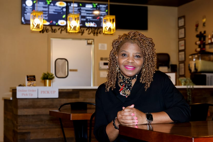 Spice and Gravy Southern Eatery owner Mary Sholars poses for a portrait inside her...