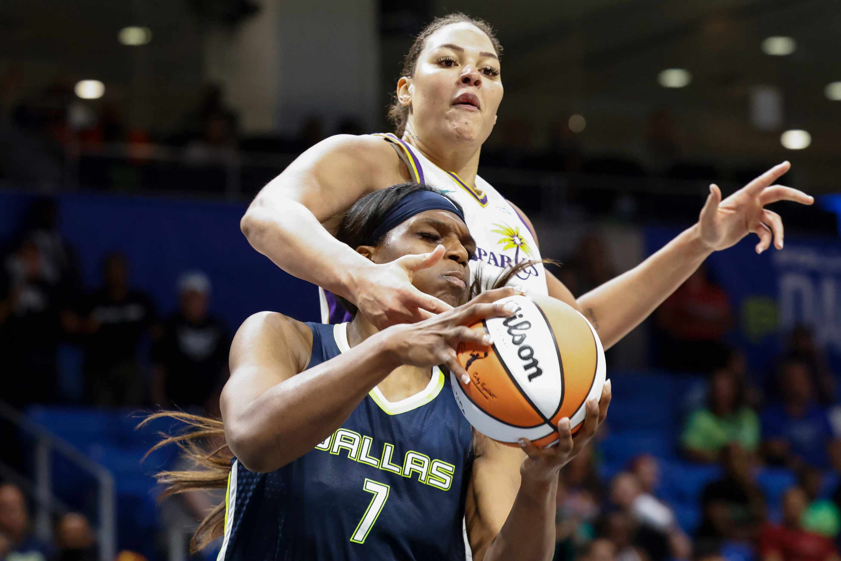 Los Angeles Sparks center Liz Cambage, back, reaches to intercept from Dallas Wings center...