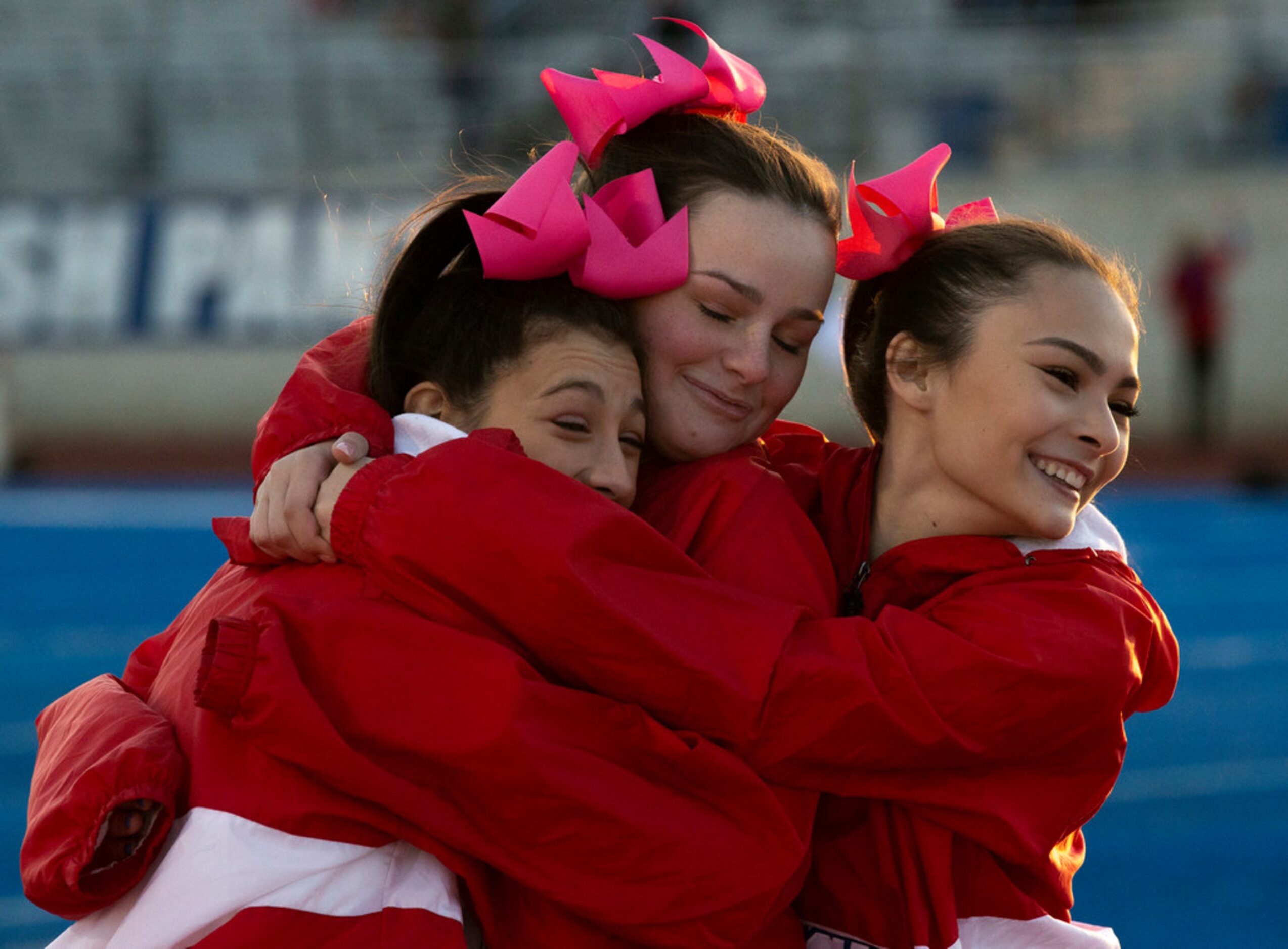 Parish Episcopal varsity cheerleader (from left) Izzi Baggett, Hope Brown and Sami Pong...