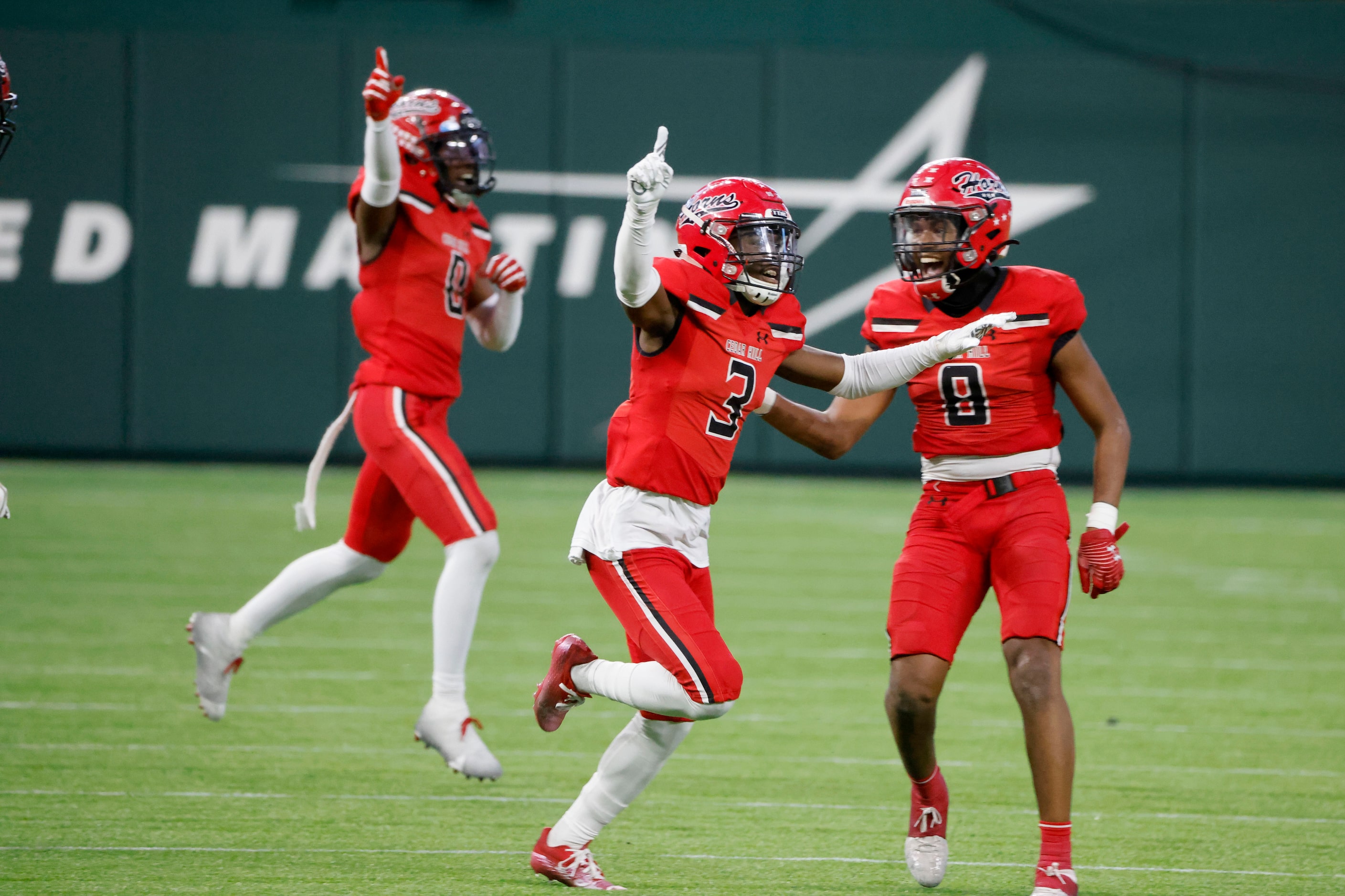 Cedar Hill players Keandre Jackson (0), Donovan Hubbard  (3) and Jakobie Clatyon (8)...