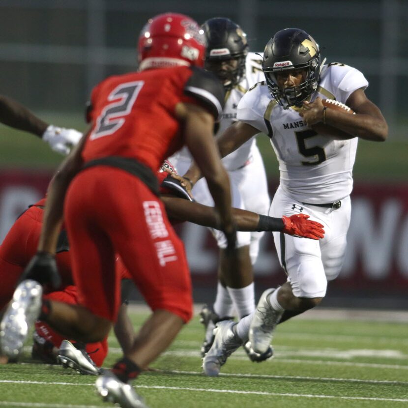 Mansfield running back Kennedy Brooks (5) breaks outside as Cedar Hill cornerback Caleb...