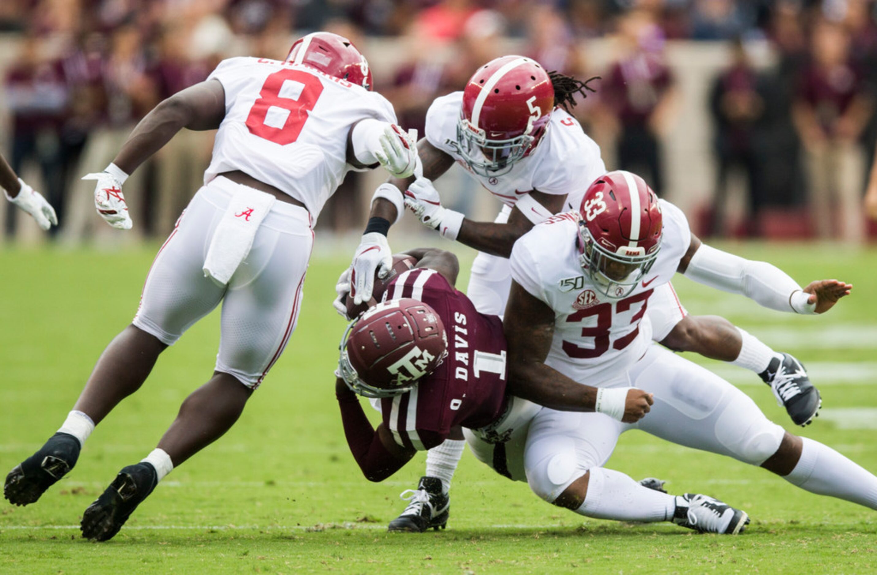 Texas A&M Aggies wide receiver Quartney Davis (1) is tackled by Alabama Crimson Tide...