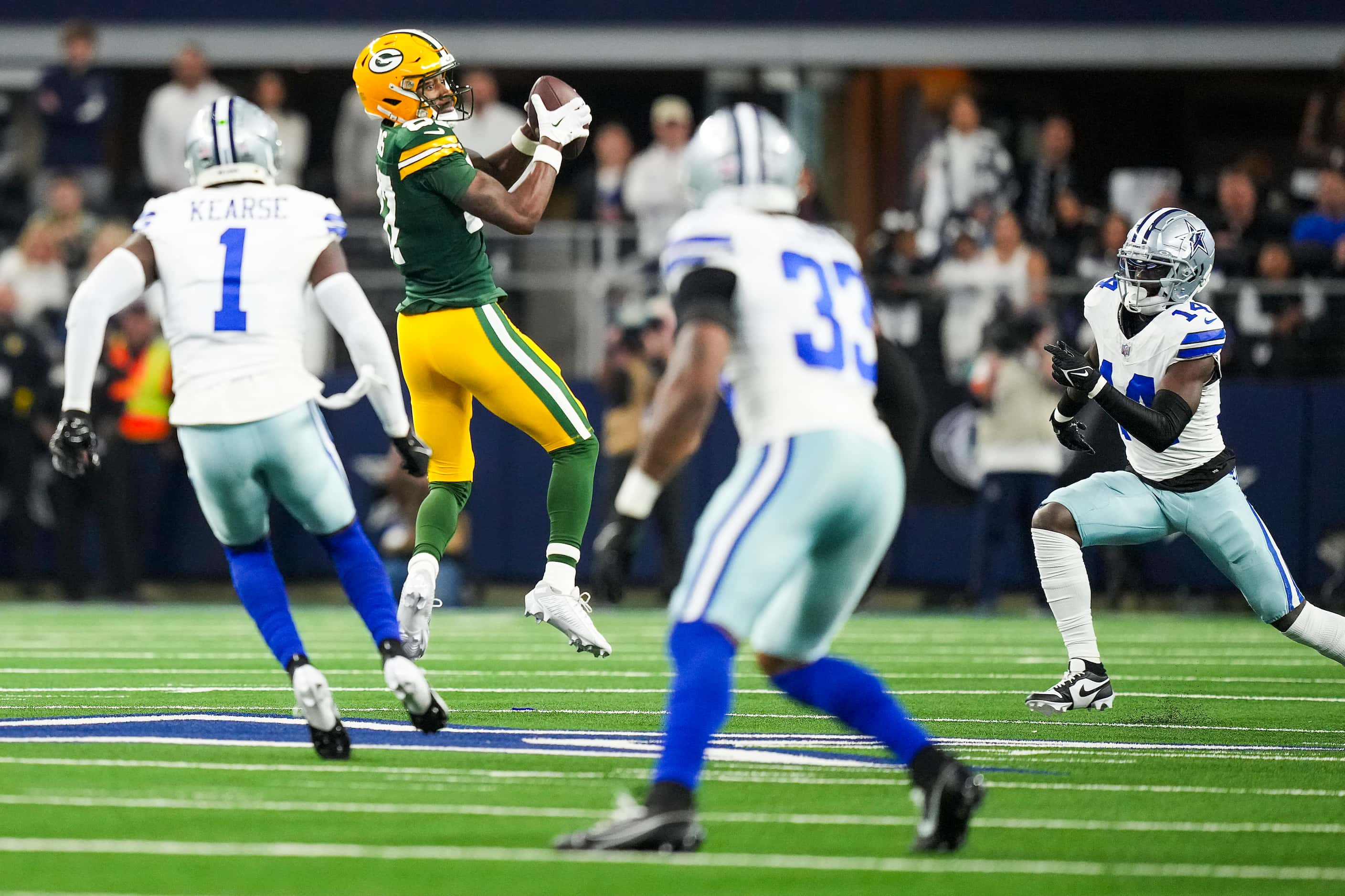 Green Bay Packers wide receiver Romeo Doubs (87) makes a catch for a first down during the...