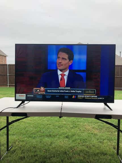 To watch the Stanley Cup Finals, Dallas Stars fan Aaron Schwarz has set up a TV outside on a...