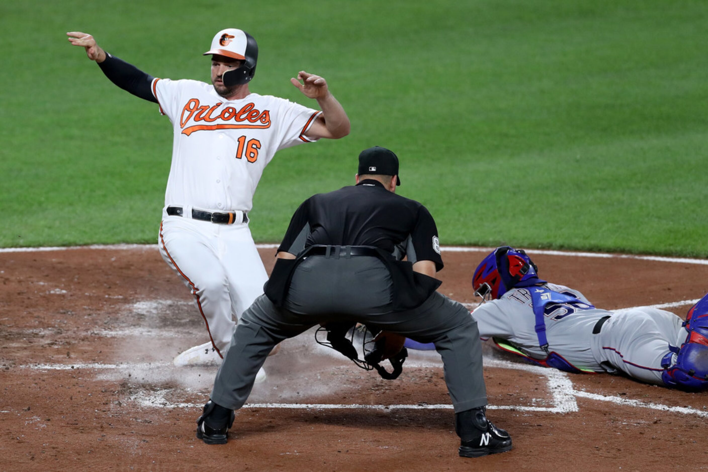 BALTIMORE, MARYLAND - SEPTEMBER 05: Trey Mancini #16 of the Baltimore Orioles scores a run...