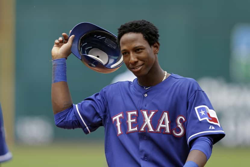 World's Jurickson Profar smiles as he hits a solo home run off United States starting...