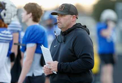 Head coach Jake Fieszel looks on as Gunter High School held practice on their field in...