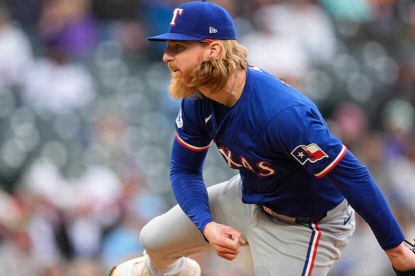 Texas Rangers starting pitcher Jon Gray works against the Colorado Rockies during the first...