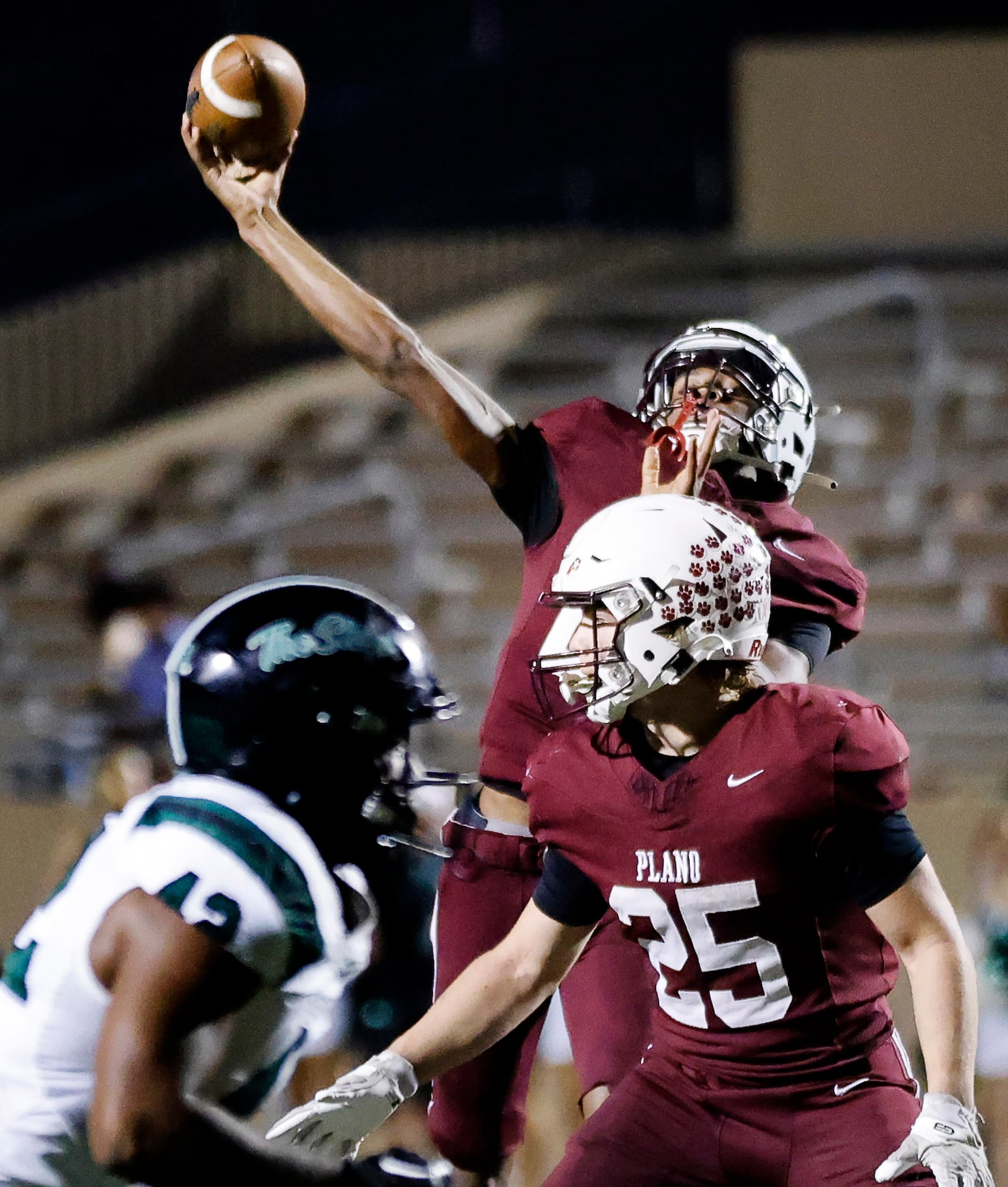 Plano High quarterback Tyree Fisher throws a second half touchdown pass to Jordan Hayes (not...