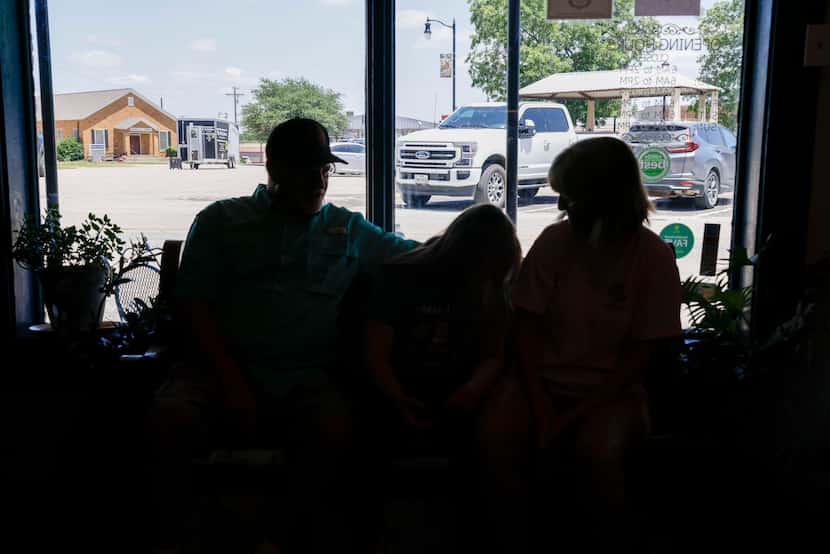 People wait for a to-go order at The Bluebonnet Cafe and Coffee Bar, Wednesday, May 29,...