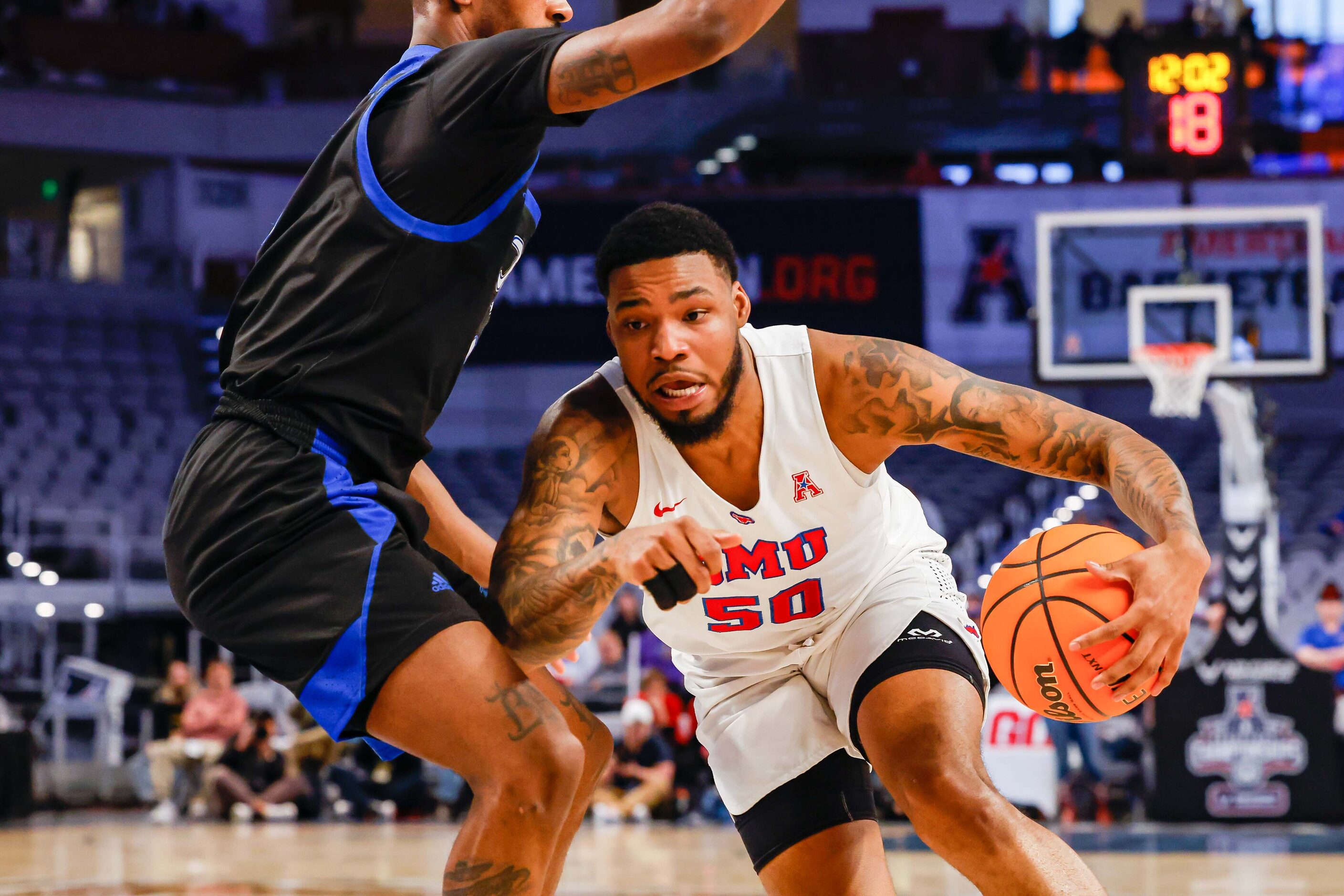 Southern Methodist Mustangs forward Marcus Weathers (50) goes around Tulsa Golden Hurricane...