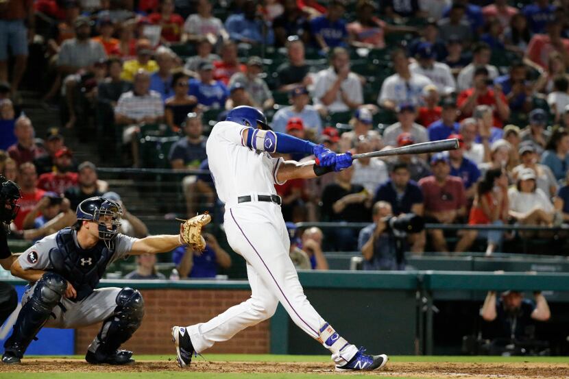 Texas Rangers third baseman Joey Gallo (13) hits his fourth inning homer during the Detroit...