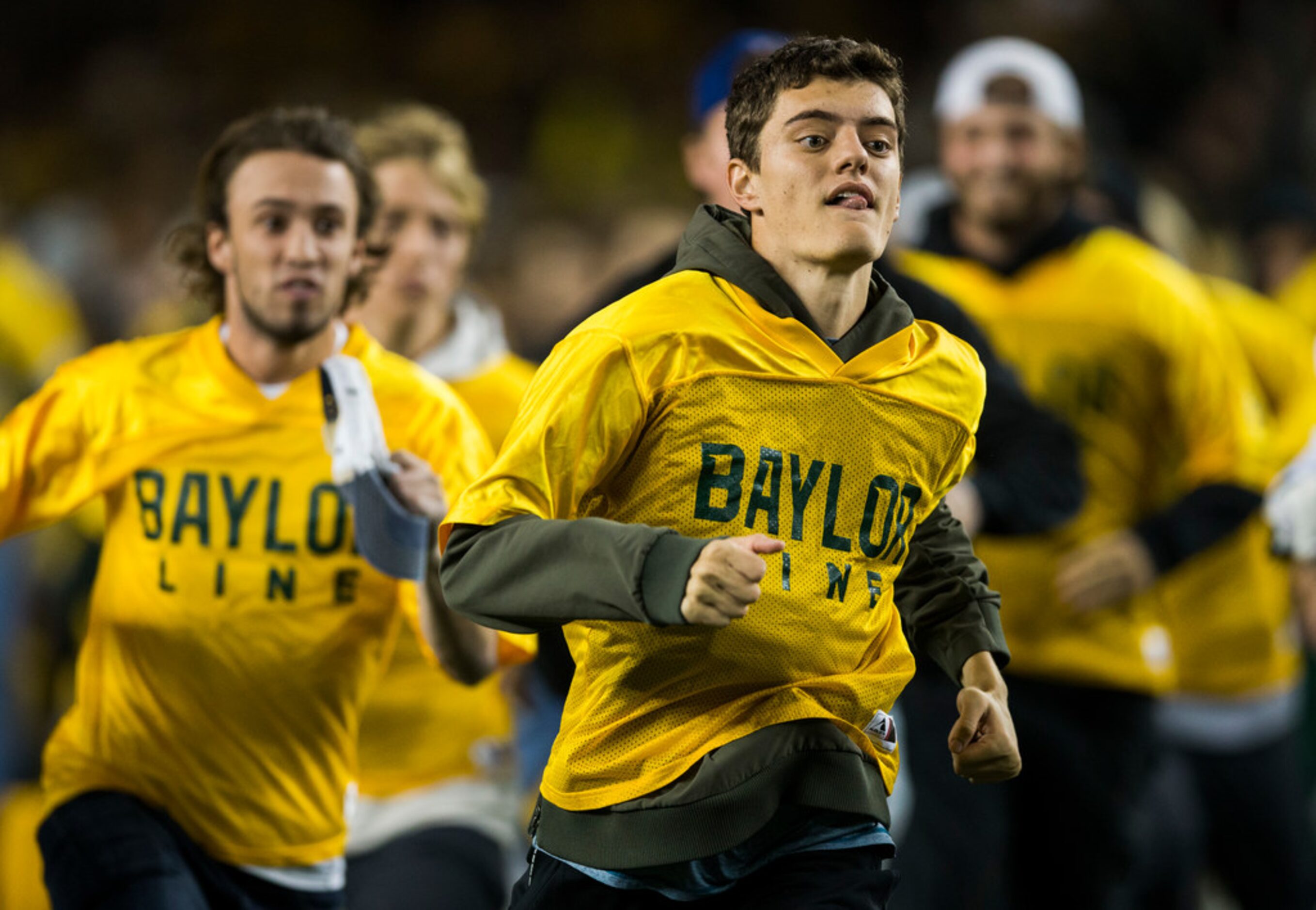 Baylor Bears run on the field before an NCAA football game between Baylor University and...