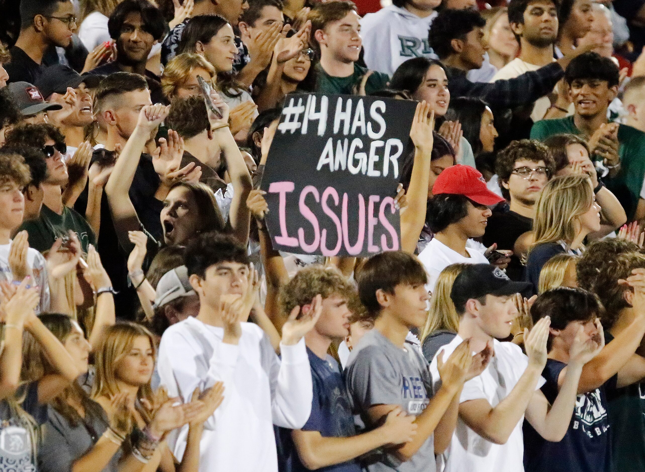 The Reedy High School student section celebrates a score during the first half as Frisco...