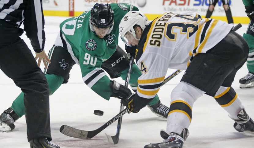 Dallas' Jason Spezza (90) and Boston's Carl Soderberg (34) fight for a face off in the third...