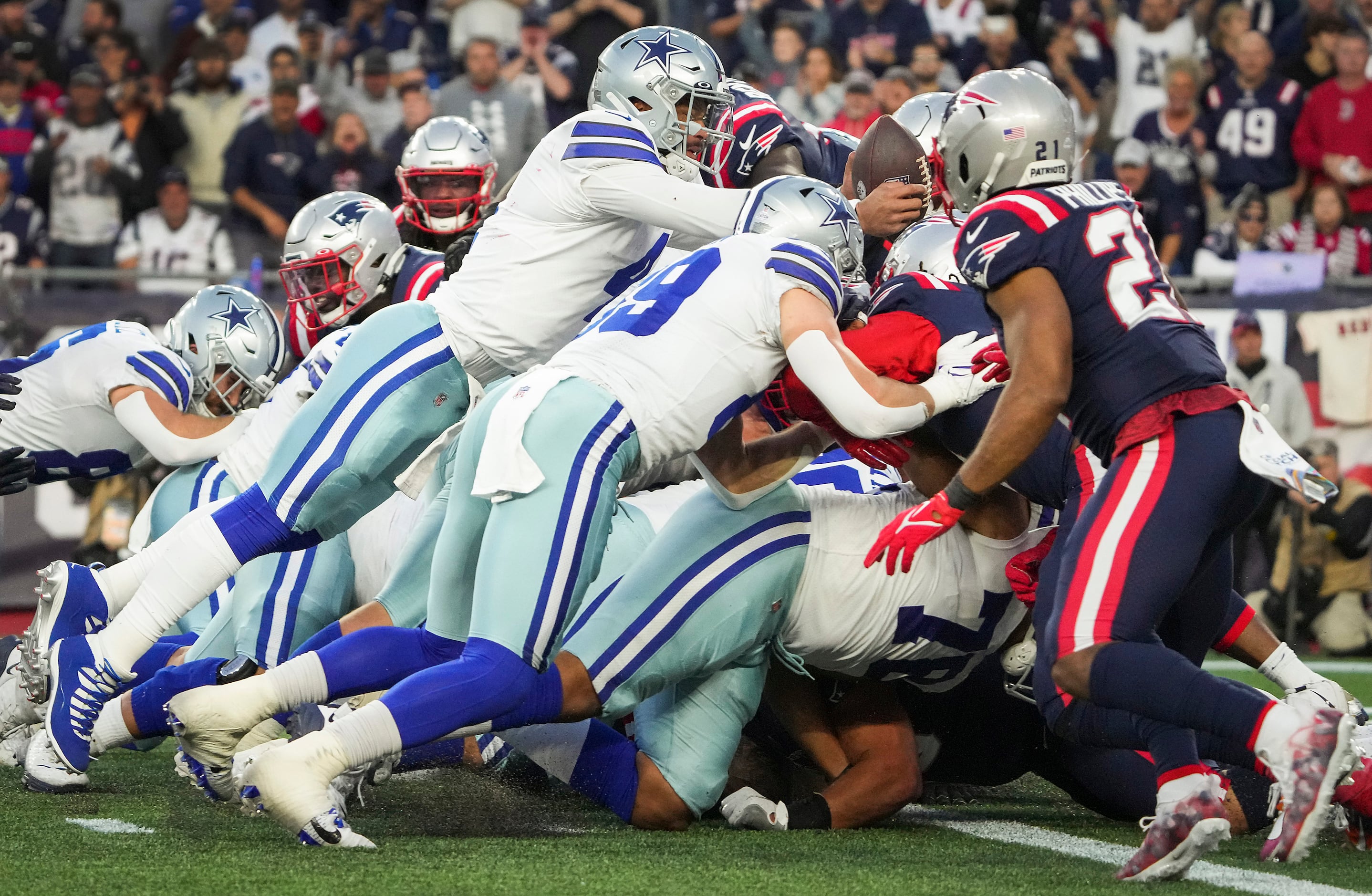 Dallas Cowboys quarterback Dak Prescott (4) loses the ball as he tries to dive into the end...