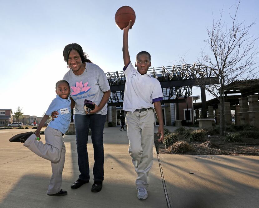 Chanelle Cook with her sons Matthew, 6, and Emmitt, 11, near their home in Buckeye Trail...
