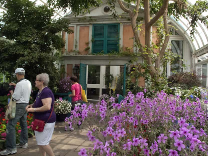 The exhibition includes a replica of the facade of Monet's pink stucco house.