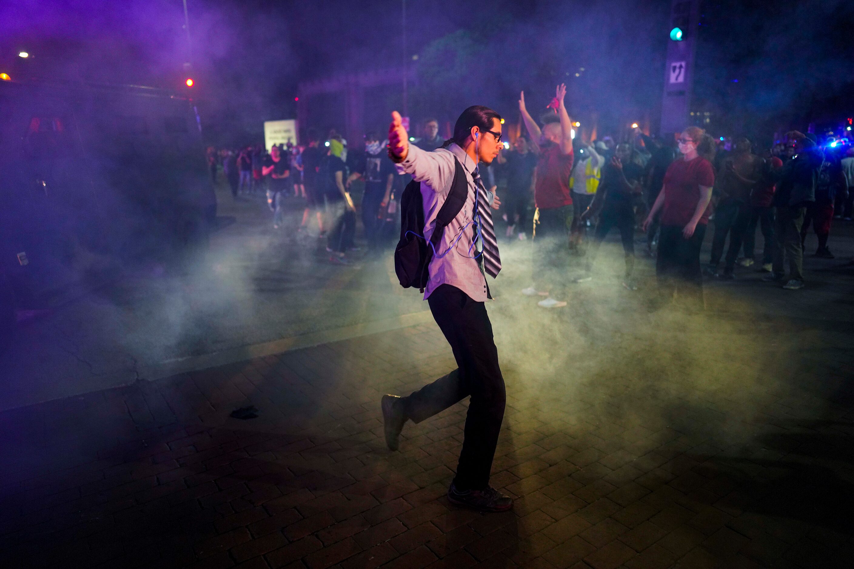 Dallas police deploy teargas to disperse protesters at the corner of of Griffin and Young...