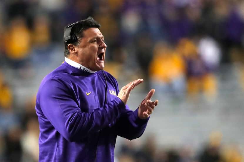 LSU head coach Ed Orgeron calls out from the sideline in the second half of an NCAA college...