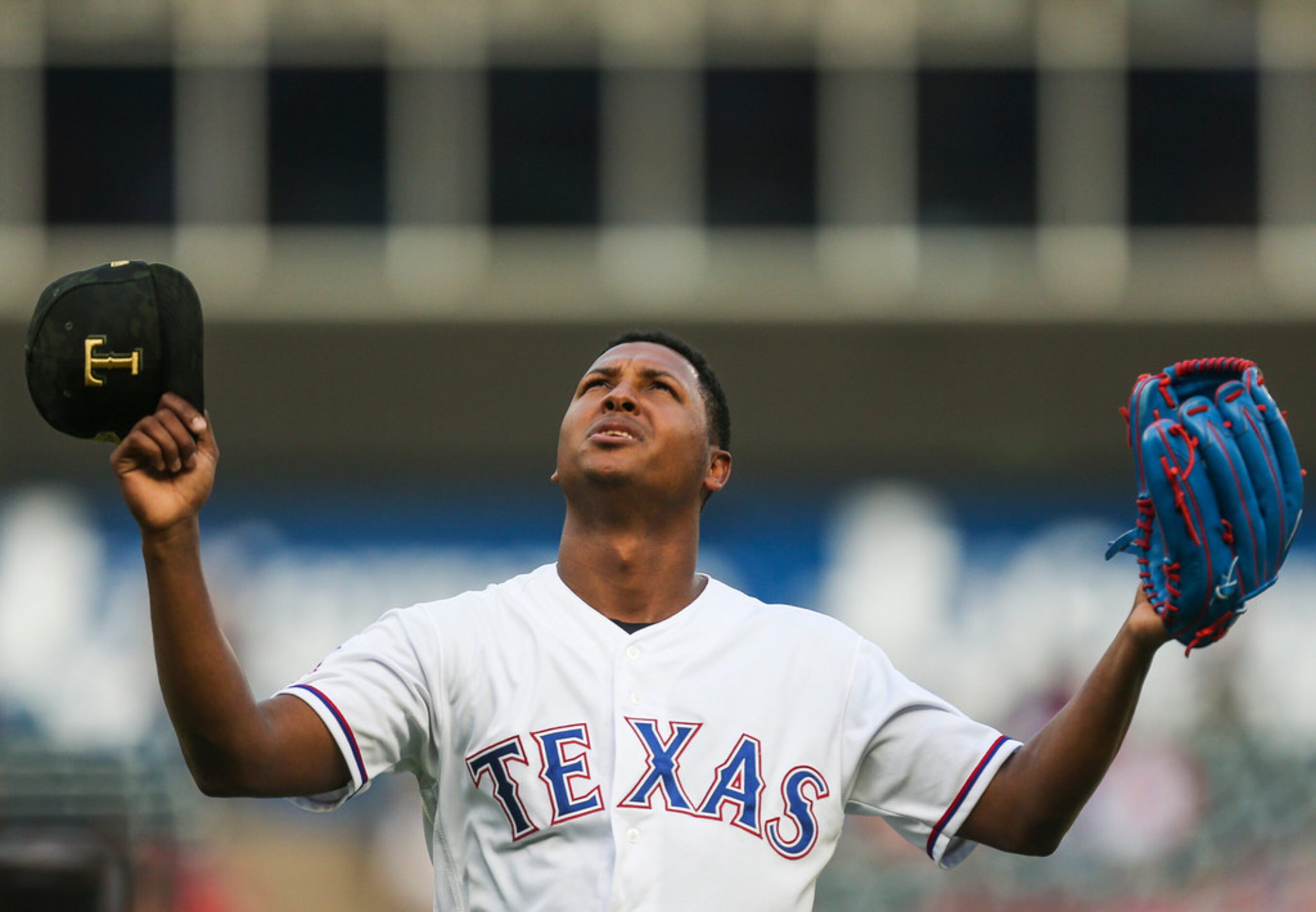 Texas Rangers starting pitcher Jose Leclerc (25) reacts after pitching the top of the first...