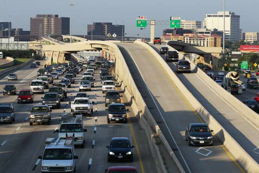 Cars pack Central Expressway's main lanes just north of LBJ Freeway, while a handful of...