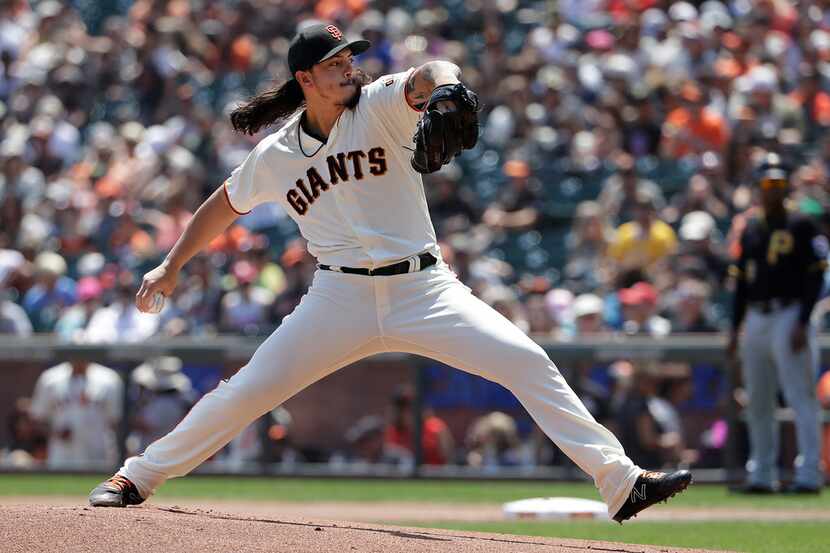 San Francisco Giants pitcher Dereck Rodriguez throws against the Pittsburgh Pirates during...