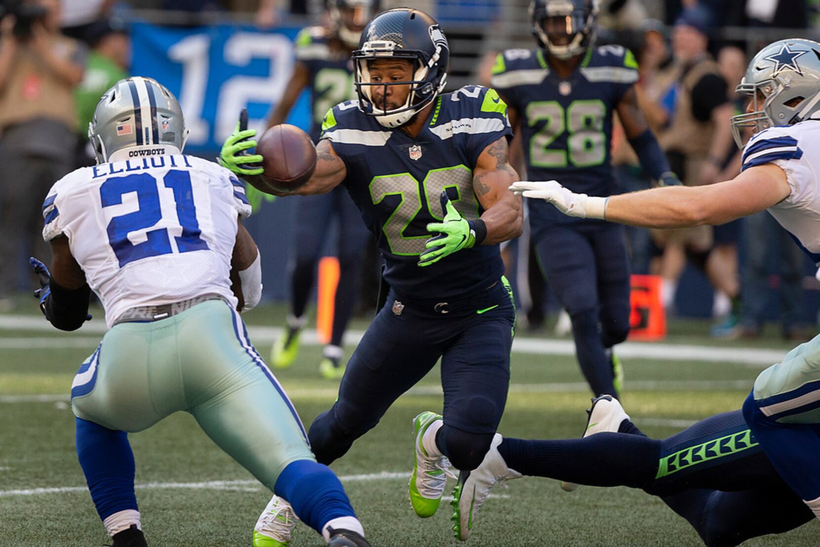 Seattle Seahawks free safety Earl Thomas, left, reaches for a pass