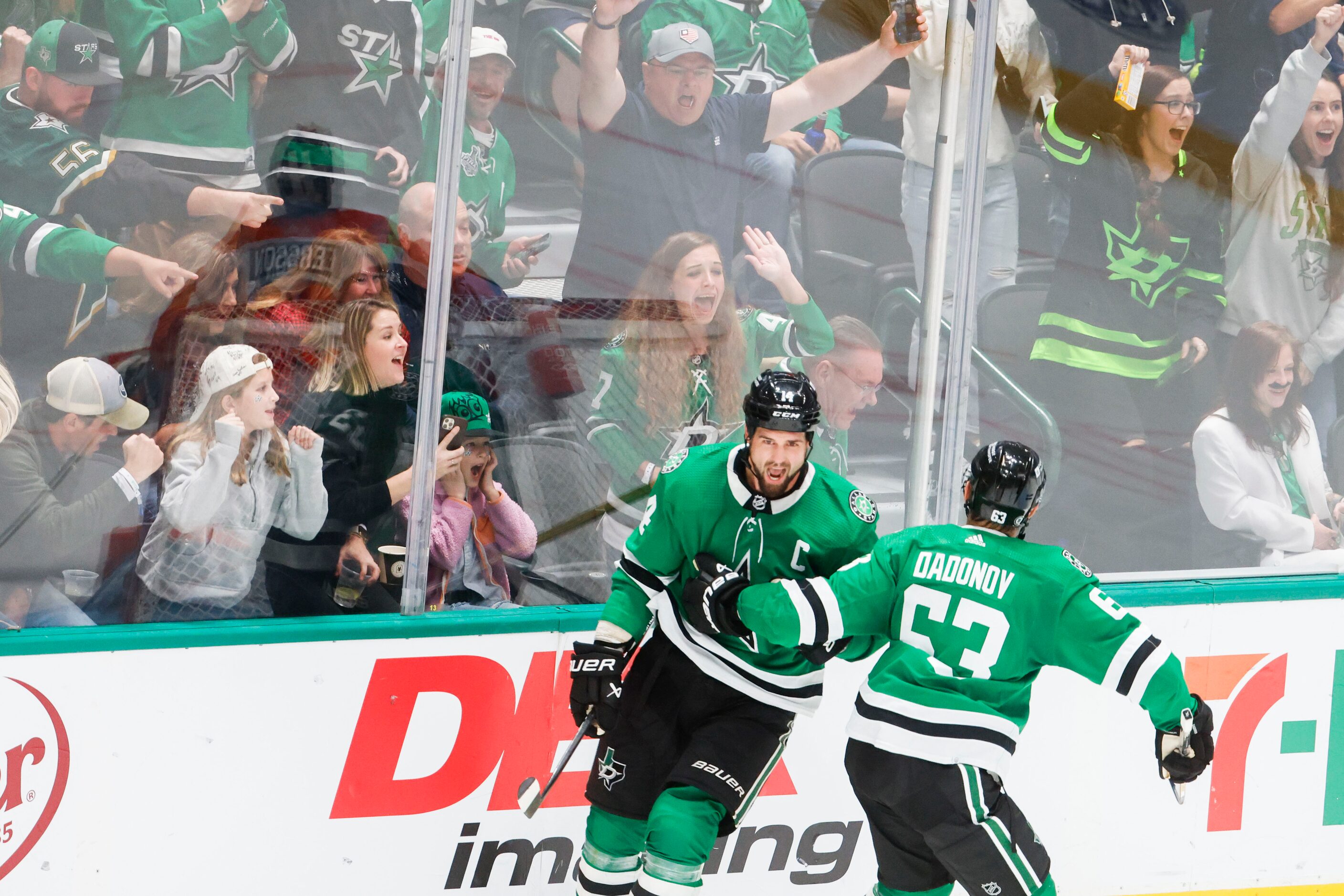 Dallas Stars left wing Jamie Benn (left) celebrates a goal with right wing Evgenii Dadonov...