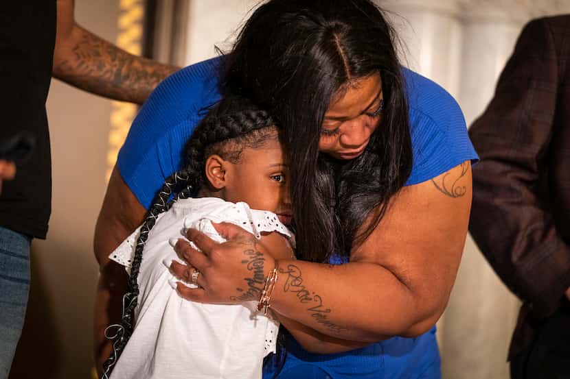 Gianna Floyd hugged her mother, Roxie Washington, during a June 2 news conference in...