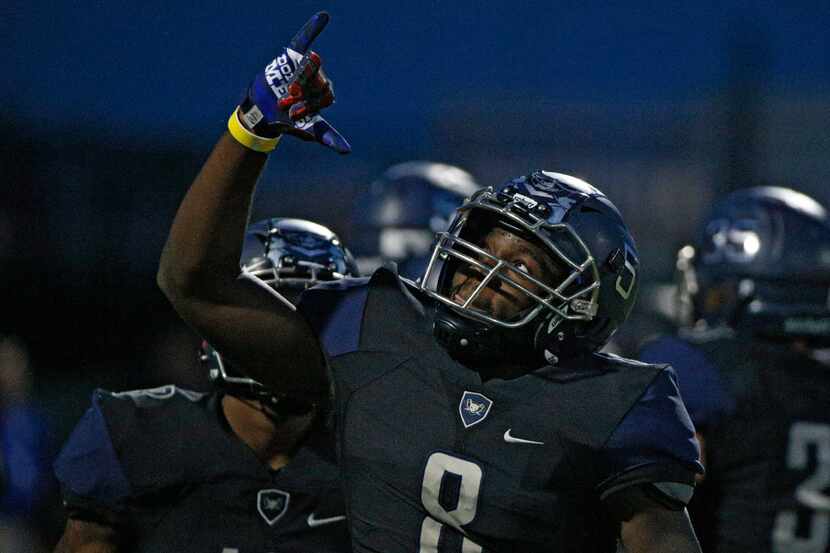 Wylie East's Eno Benjamin celebrates a  touchdown against Forney in the first half at Wylie...