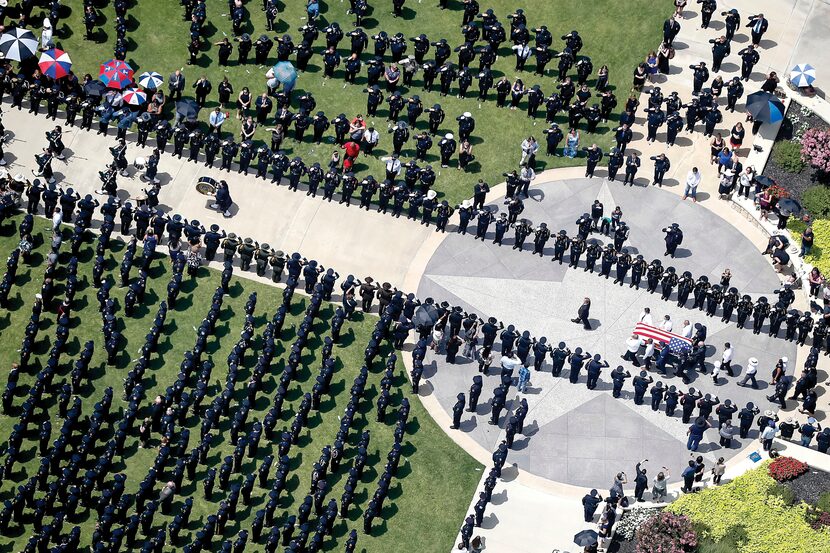 The casket of slain Dallas police officer Patrick Zamarripa was carried carried by...