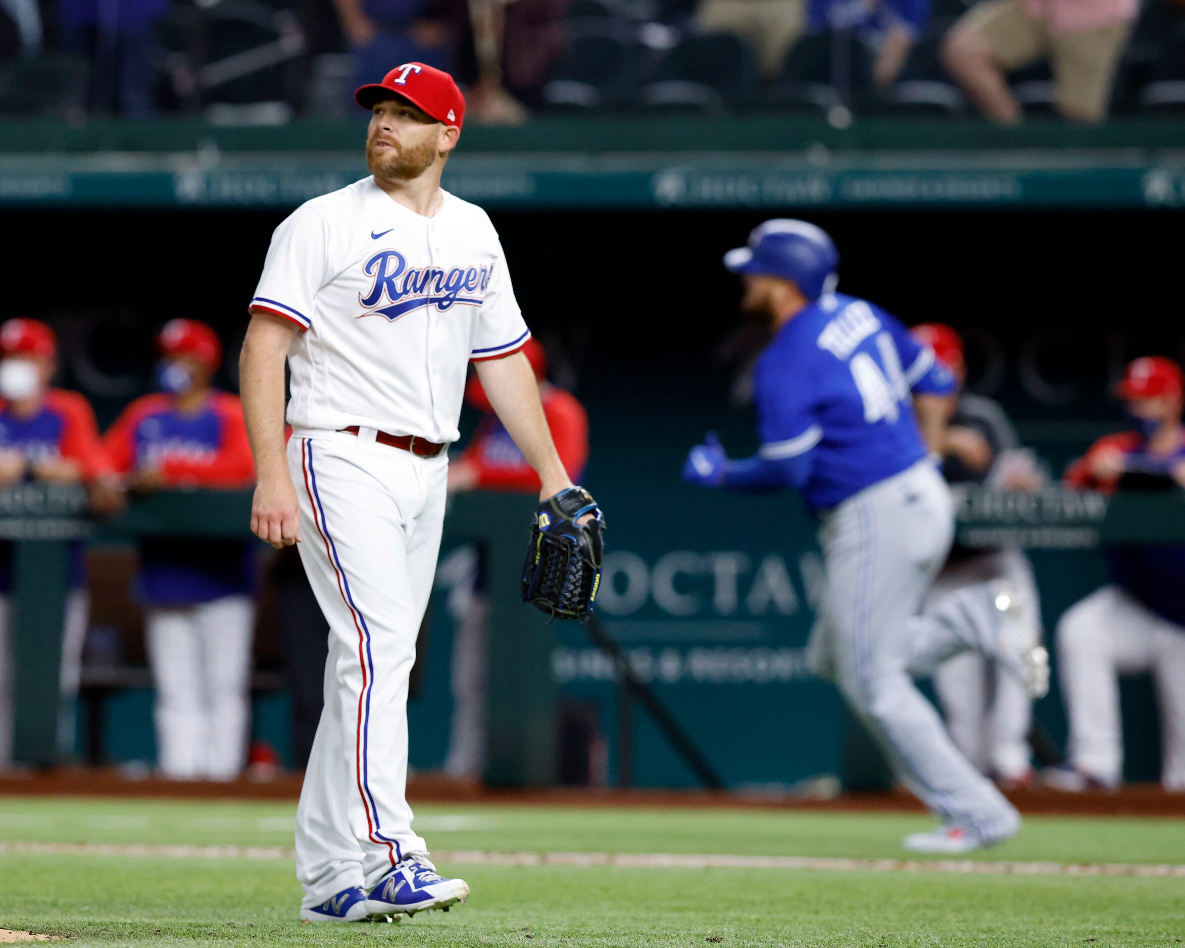 Texas Rangers relief pitcher Ian Kennedy (31) watches the final out by Toronto Blue Jays...