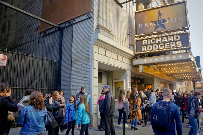 In this 2016 file photo, people line up to see the Broadway play Hamilton in New York.